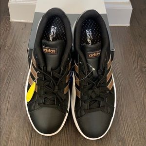 Adidas Grand Court sneakers.